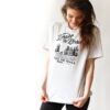 smiling woman in black and white print t-shirt