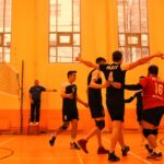 group of men playing basketball