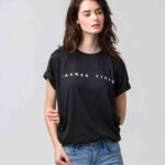 woman in black crew neck t-shirt and blue denim jeans