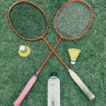 pair of red badminton rackets